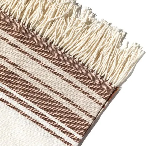 Recycled beach blankets by Sackcloth & Ashes: Horizon Terra striped beach blanket fringe detail.